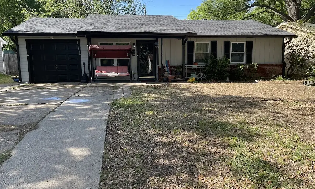 Asphalt Shingle Roof Repair crew at work on a residential roof in Meridian